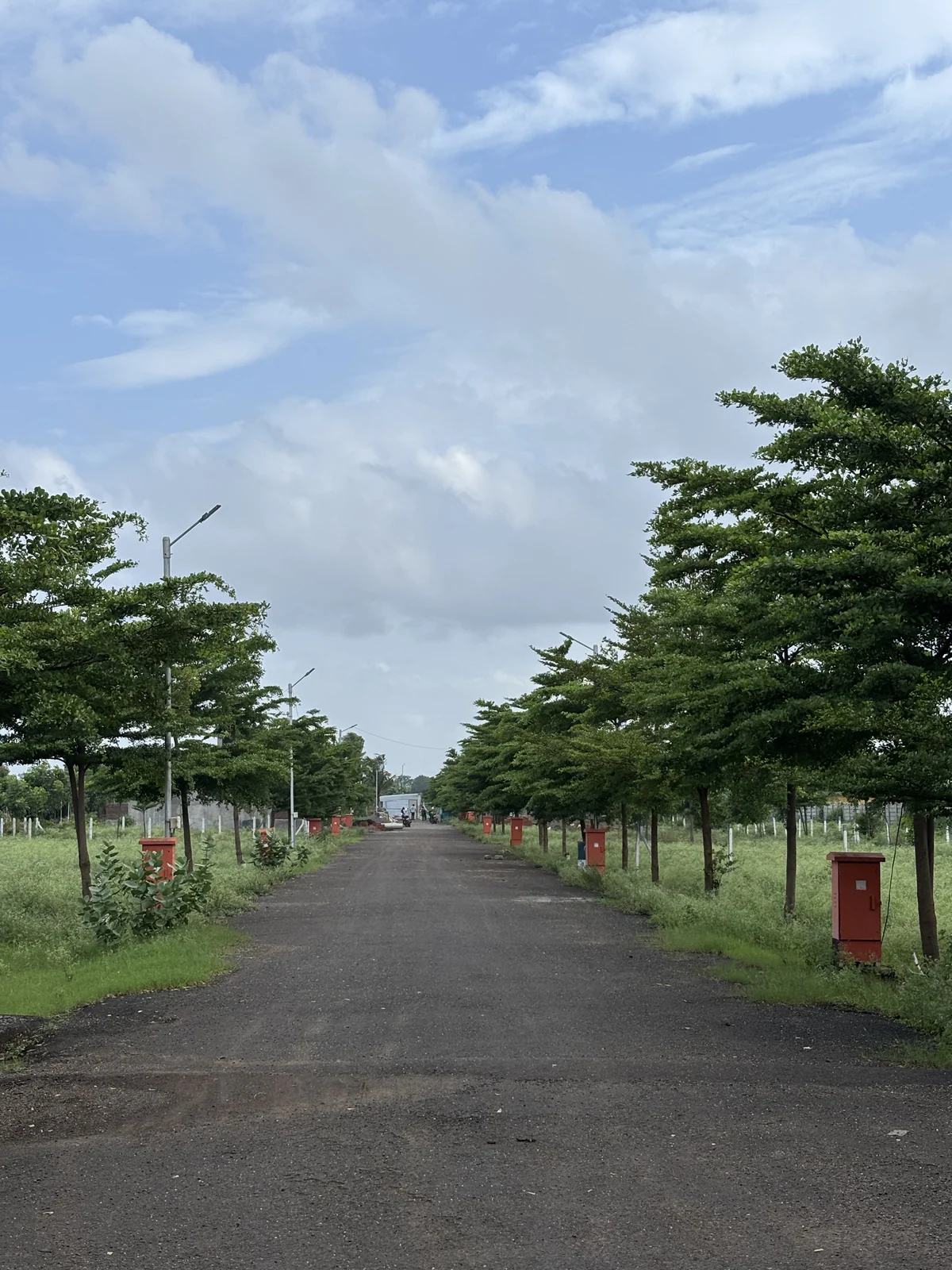 Wide internal road with street lights at Vrindavan Park